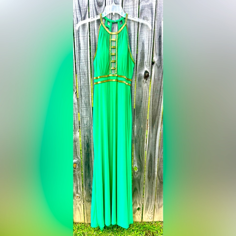 Full length green formal dress with gold beading accents.